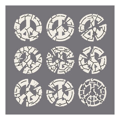 Collection of distressed peace symbols showing fragmentation and decay on a gray background, representing concepts of conflict and broken ideals
