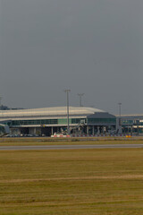A plane is commencing its takeoff procedure from an airport runway, preparing for flight into the vast sky above. This event takes place at an airport, an important transportation hub