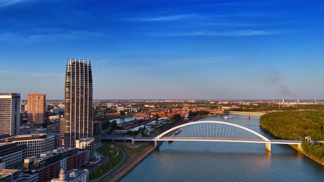 Descending over the Danube at sunset time. View on the Appolo Bridge in Bratislava, Slovakia.