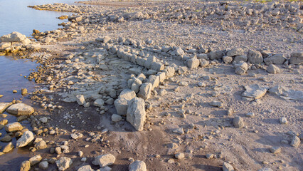Ancient nuraghe and giants' tomb submerged by Monte Prano lake in Tratalias Sardinia