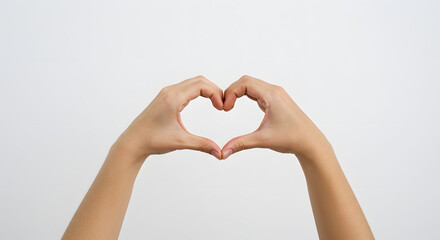 Obraz premium Hands forming heart shape convey love, affection, and heartfelt emotions for branding or social impact with white background