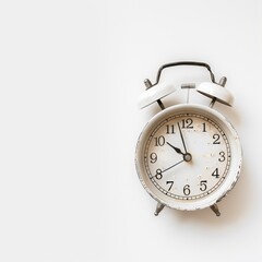 Vintage white alarm clock on white background