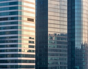 Fototapeta premium Modern Glass High-Rises with Reflective Facades and Architectural Symmetry