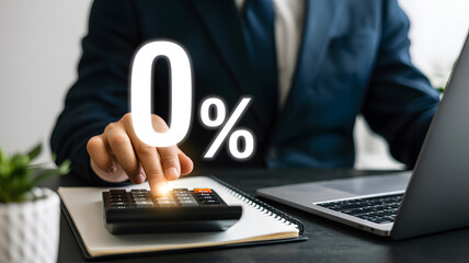 Zero percent interest rate on business loan with calculator and laptop setup