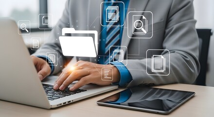 Professional businessman efficiently managing digital files and data on laptop, symbolizing modern business organization and information flow.