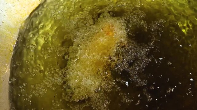 Mirchi vada or mirchi bada fried indian snack being prepared 