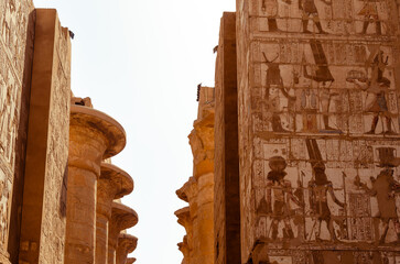 View between tall temple walls with hieroglyphs at Karnak in Luxor Egypt 28 February 2025