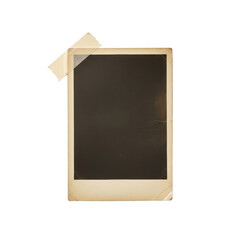 An aged rectangular photographic print with yellowing, subtle creases, and a sepia border, featuring vintage ad imagery, adhered by light brown masking tape to a transparent surface in a top-down,