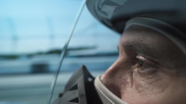 Intense video of a helmeted driver on the track, sharp focus, high-speed action captured.