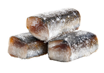 Three stacked, oblong pieces of cured or preserved fish, coated in a light, grayish-white powder.  The fish flesh shows a pale, pinkish-tan hue underneath