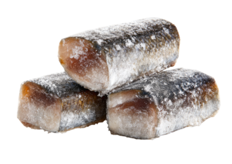 Three stacked, oblong pieces of cured or preserved fish, coated in a light, grayish-white powder.  The fish flesh shows a pale, pinkish-tan hue underneath