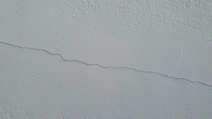 Small cracks on the white wall