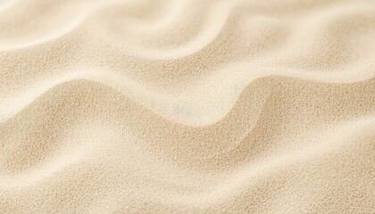 Golden grains and smooth waves create a beautiful and serene abstract sand background with interesting texture.