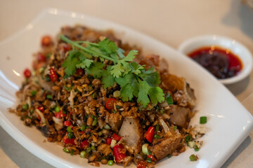 Stir Fried Crispy Pork Belly with Salt and Chili, served on plate