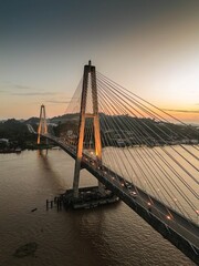 Obraz premium Aerial View of Mahakam Bridge at Sunset in Samarinda, Indonesia