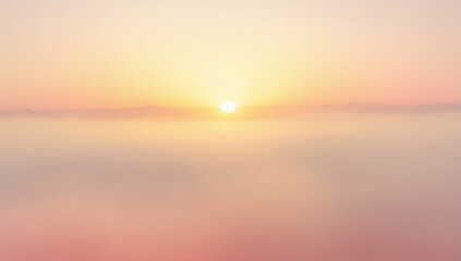 Obraz premium Soft focus sunset over calm water with warm golden and pink hues creating a serene atmosphere