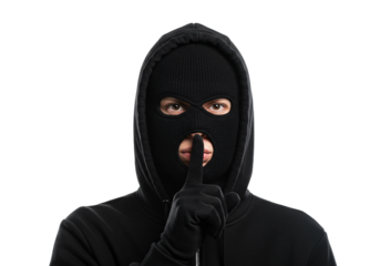 A person wearing a black balaclava and hoodie holding a finger to their lips in a shushing gesture isolated on transparent background