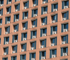 The air conditioning units outside the hotel are neatly arranged