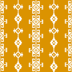 A vibrant geometric pattern featuring white designs on a mustard yellow background, showcasing intricate shapes and a bold aesthetic.
