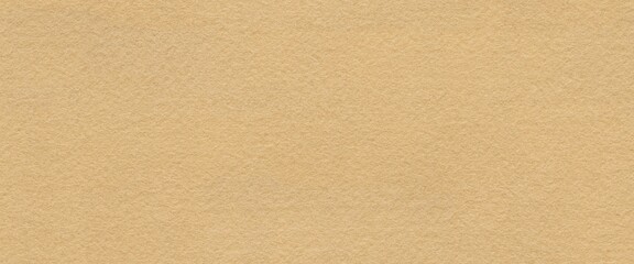 Fototapeta premium The seamless textured felt of beige felt offers a visual symphony of warmth, blending simplicity with sophistication