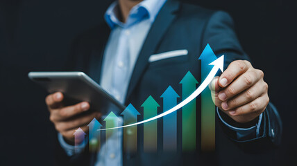 Businessman Drawing Upward Growth Chart on Tablet