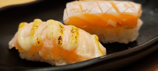Sushi on a black plate Japanese food