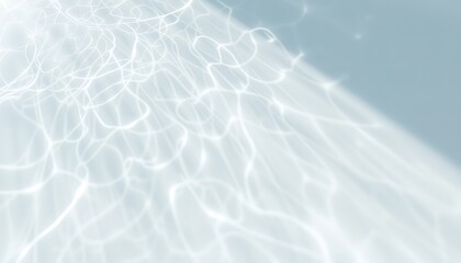 Subtle light reflections create an abstract pattern of shimmering lines on a soft, cool-toned background, evoking a sense of calm and gentle movement