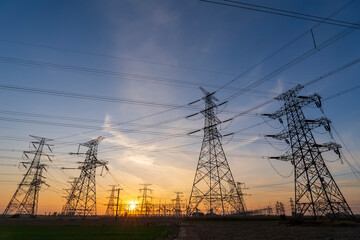 The pylons are in the evening, Substation in the evening, High voltage substation and beautiful sunset glow