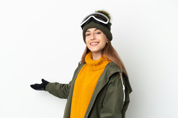 Skier caucasian woman with snowboarding glasses isolated on white background extending hands to the side for inviting to come