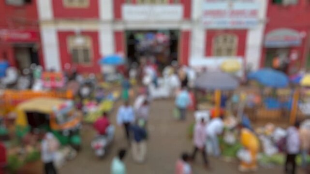 Bokeh view of street vegetable market in Bangalore, India. Blurred background footage.