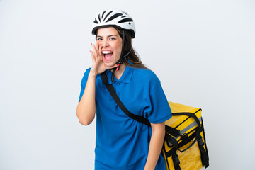 Young delivery woman with thermal backpack isolated on white background shouting with mouth wide open
