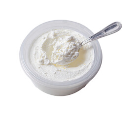 Creamy, white dairy product in a clear plastic container. A silver spoon is partially submerged in the thick, textured substance