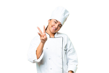 Young woman Chef over isolated chroma key background happy and counting three with fingers
