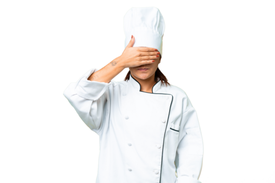 Young woman Chef over isolated chroma key background covering eyes by hands. Do not want to see something