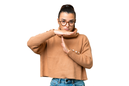 Young beauty woman over isolated chroma key background making time out gesture - Powered by Adobe