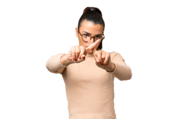 Young beauty woman over isolated chroma key background making stop gesture with her hand to stop an act