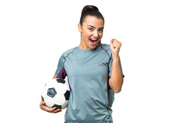 Young football player Woman over isolated chroma key background celebrating a victory in winner position