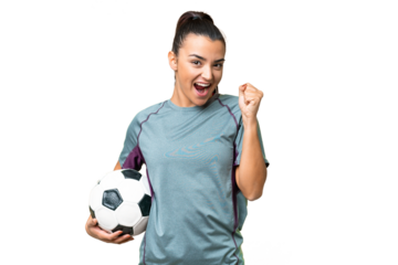 Young football player Woman over isolated chroma key background celebrating a victory in winner position
