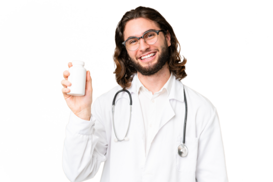 Young handsome man over isolated chroma key background wearing a doctor gown and holding pills