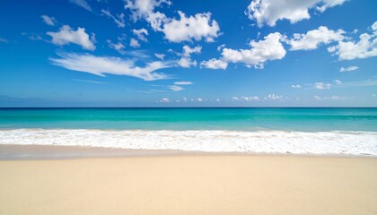 Tranquil beach scene with gentle waves lapping a pristine shore under a vibrant blue sky