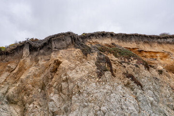 Biotite - hornblende quartz diorite to granodiorite (Granitic Rocks) . Garrapata Beach, California State Route 1, Monterey County. Santa Lucia Range