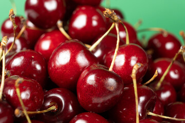 Fresh Sweet Cherries with Vibrant Green Backdrop.