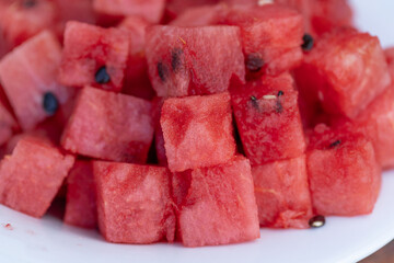 Freshly sliced watermelon on a plate, ready to eat