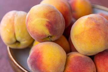 Pile of Fresh, Ripe Peaches Displayed Outdoors
