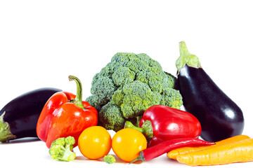 Fresh shiny multicolored vegetables isolated on white background.