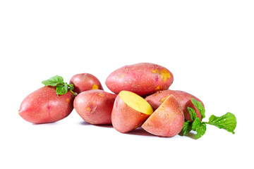 Heap of red potatoes with leaves isolated on white background.
