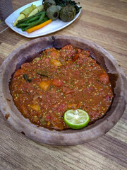 Sambal terasi is a traditional Indonesian chili paste made with chili peppers and terasi (fermented shrimp paste). It is one of the most popular types of sambal across Indonesia, known for its spicy, 