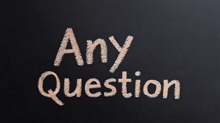 A chalkboard with the words "Any Question" written in chalk. The words are centered on the board and the chalk writing gives it a textured look.