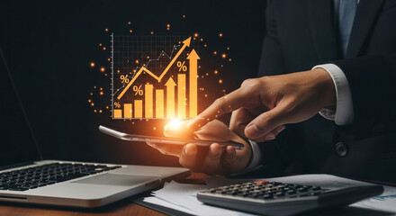 Person analyzing financial growth charts on a mobile device with laptop and calculator