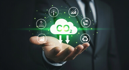Person presenting environmental sustainability icons with a co2 cloud graphic